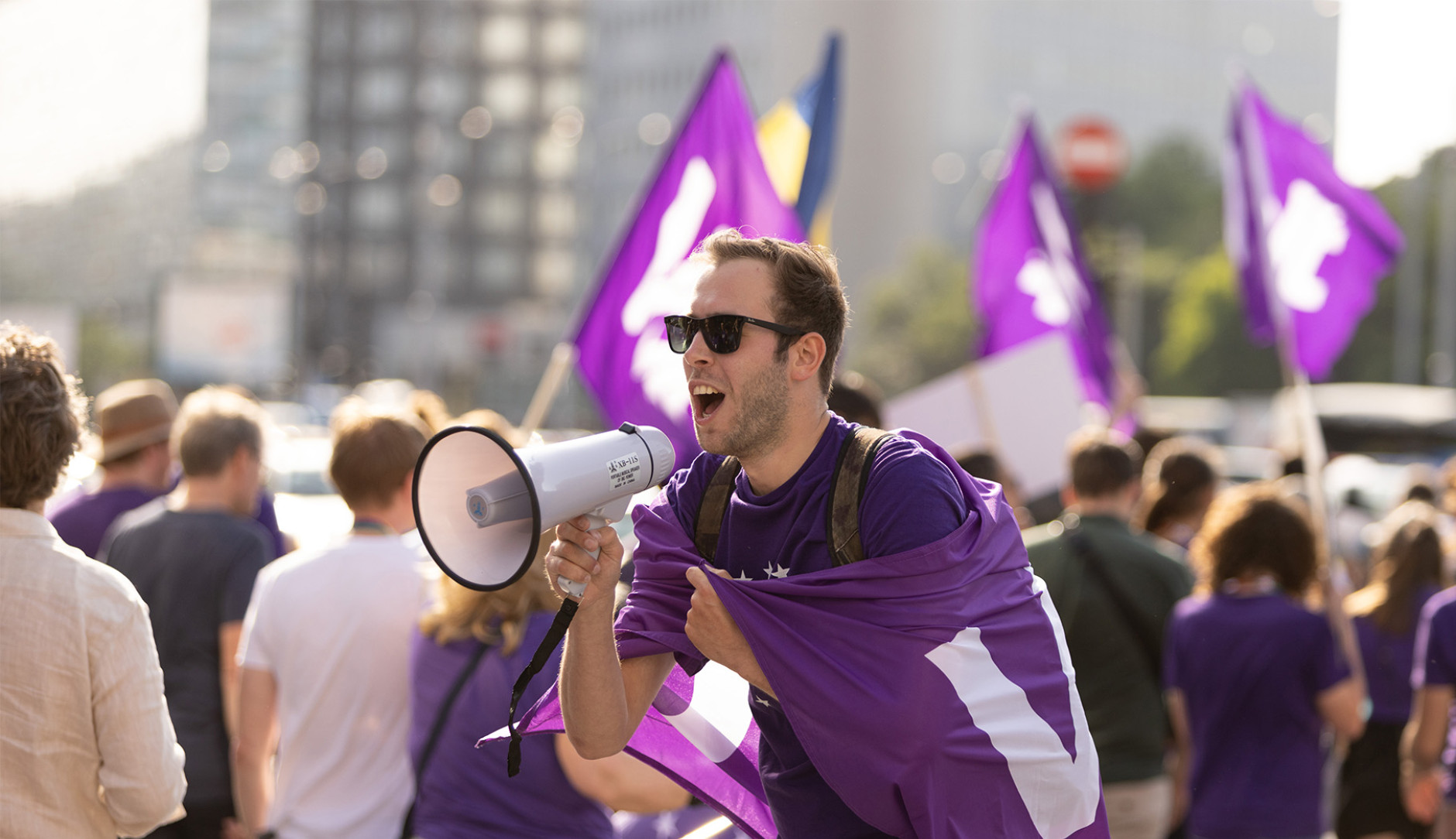 Volter with megaphone in crowd